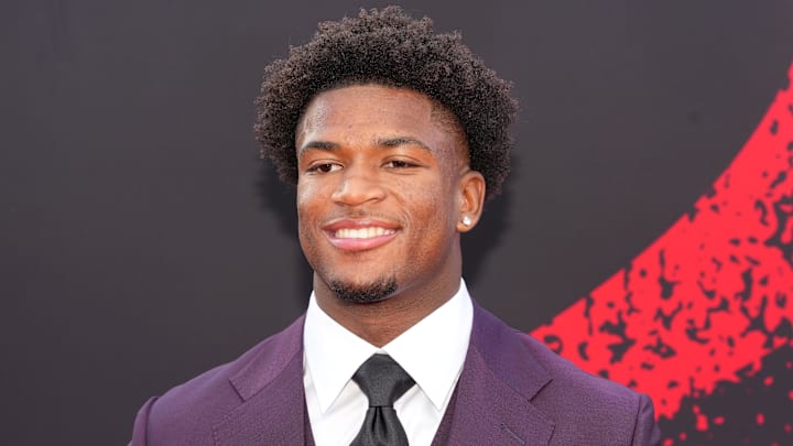 Dallas Cowboys defensive back Caleb Downs poses on the red carpet before the 2026 NFL Draft.