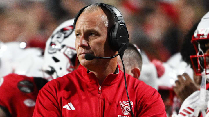 Nov 1, 2025; Raleigh, North Carolina, USA;  NC State Wolfpack head coach Dave Doeren during the first quarter at Carter-Finley Stadium. Mandatory Credit: Zachary Taft-Imagn Images