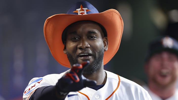 Apr 15, 2026; Houston, Texas, USA; Houston Astros designated hitter Yordan Alvarez reacts in the dugout after hitting a home run during the third inning against the Colorado Rockies at Daikin Park. Mandatory Credit: Troy Taormina-Imagn Images