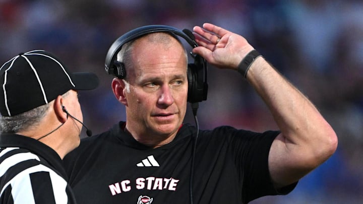 Sep 20, 2025; Durham, North Carolina, USA; NC State Wolfpack head coach Dave Doeren reacts to a call during the fourth quarter against the Duke Blue Devils at Wallace Wade Stadium. Mandatory Credit: Zachary Taft-Imagn Images Sep 20, 2025; Durham, North Carolina, USA; NC State Wolfpack head coach Dave Doeren reacts to a call during the fourth quarter against the Duke Blue Devils at Wallace Wade Stadium. Mandatory Credit: Zachary Taft-Imagn Images
