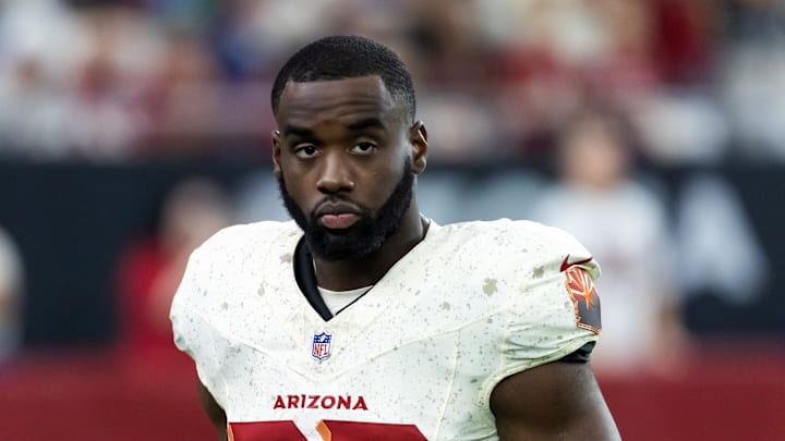 Sep 25, 2025; Glendale, Arizona, USA; Arizona Cardinals running back Trey Benson (33) against the Seattle Seahawks at State Farm Stadium. Mandatory Credit: Mark J. Rebilas-Imagn Images