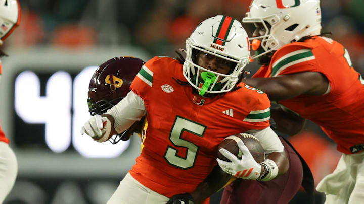 Sep 6, 2025; Miami Gardens, Florida, USA; Miami Hurricanes wide receiver Ray Ray Joseph (5) runs with the football against Bethune-Cookman Wildcats cornerback Johnny Harris III (8) during the second quarter at Hard Rock Stadium. Mandatory Credit: Sam Navarro-Imagn Images Sep 6, 2025; Miami Gardens, Florida, USA; Miami Hurricanes wide receiver Ray Ray Joseph (5) runs with the football against Bethune-Cookman Wildcats cornerback Johnny Harris III (8) during the second quarter at Hard Rock Stadium. Mandatory Credit: Sam Navarro-Imagn Images
