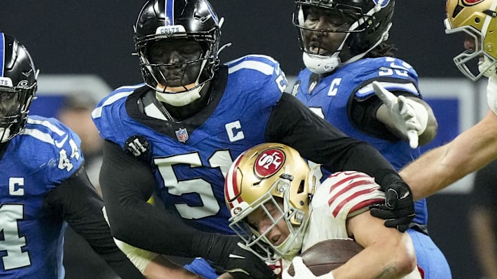 Dec 22, 2025; Indianapolis, Indiana, USA; Indianapolis Colts defensive end Kwity Paye (51) tackles San Francisco 49ers running back Christian McCaffrey (23) during the fourth quarter at Lucas Oil Stadium. Mandatory Credit: Grace Hollars-USA TODAY Network via Imagn Images