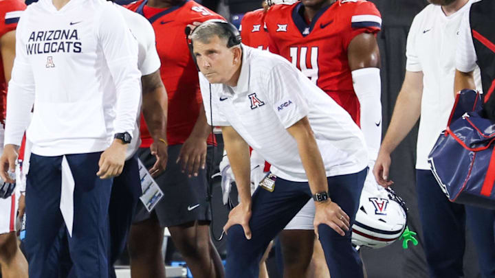 Sep 6, 2025; Tucson, Arizona, USA; Arizona Wildcats head coach Brent Brennan watches from the sidelines during the first quarter of the game against the Weber State Wildcats at Arizona Stadium. Mandatory Credit: Aryanna Frank-Imagn Images Sep 6, 2025; Tucson, Arizona, USA; Arizona Wildcats head coach Brent Brennan watches from the sidelines during the first quarter of the game against the Weber State Wildcats at Arizona Stadium. Mandatory Credit: Aryanna Frank-Imagn Images