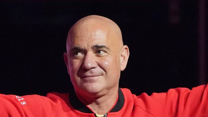 Andre Agassi waves to the crowd