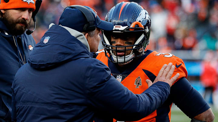 Oct 29, 2023; Denver, Colorado, USA; Denver Broncos head coach Sean Payton talks with quarterback Russell Wilson (3) and quarterbacks coach Davis Webb in the fourth quarter against the Kansas City Chiefs at Empower Field at Mile High. Oct 29, 2023; Denver, Colorado, USA; Denver Broncos head coach Sean Payton talks with quarterback Russell Wilson (3) and quarterbacks coach Davis Webb in the fourth quarter against the Kansas City Chiefs at Empower Field at Mile High.