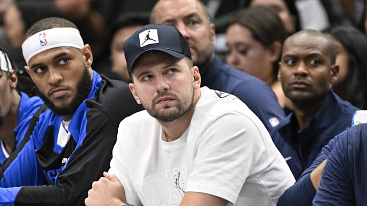 Oct 7, 2024; Dallas, Texas, USA; Dallas Mavericks guard Luka Doncic (77) looks on from the bench during the game between the Dallas Mavericks and the Memphis Grizzlies at American Airlines Center. Mandatory Credit: Jerome Miron-Imagn Images