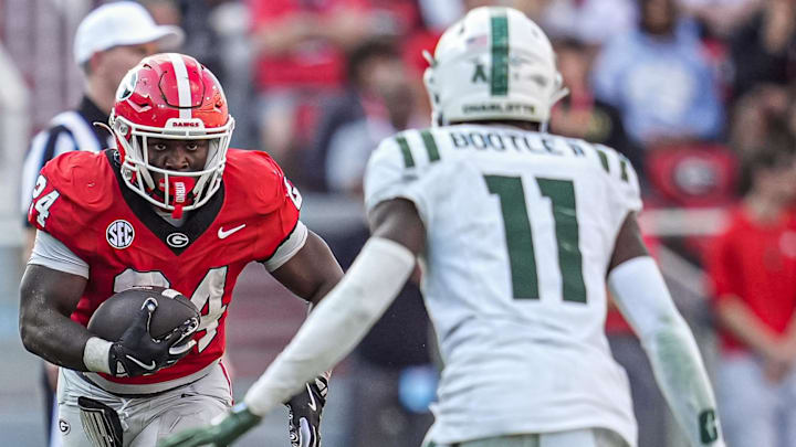 Nov 22, 2025; Athens, Georgia, USA; Georgia Bulldogs running back Bo Walker (24) runs against Charlotte 49ers defensive back Dwight Bootle II (11) during the second half at Sanford Stadium. Mandatory Credit: Dale Zanine-Imagn Images
