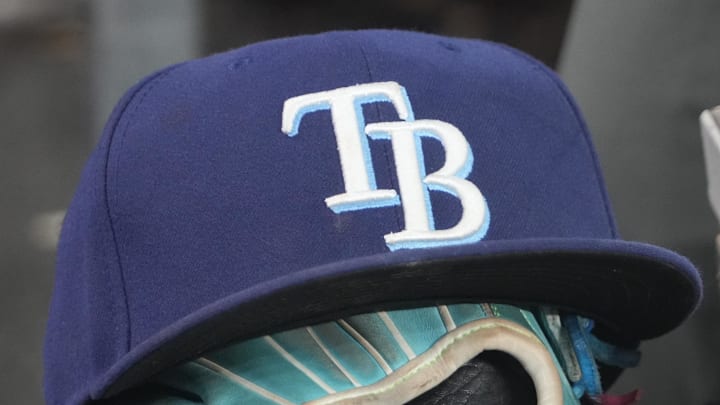 Sep 26, 2025; Toronto, Ontario, CAN; The hat and glove of Tampa Bay Rays third baseman Junior Caminero (13) in the dugout during the game against the Toronto Blue Jays at Rogers Centre. 