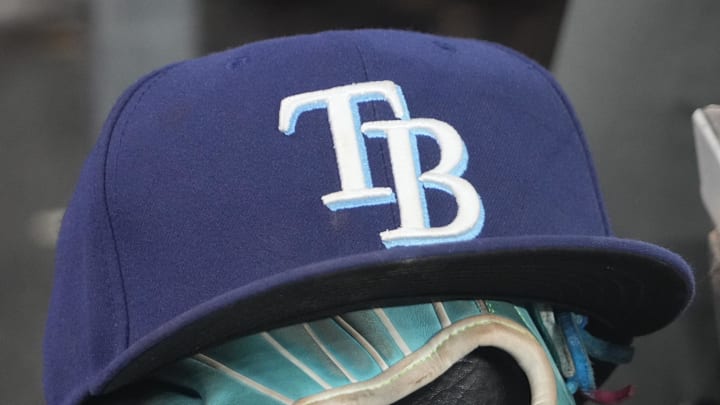 Sep 26, 2025; Toronto, Ontario, CAN; The hat and glove of Tampa Bay Rays third baseman Junior Caminero (13) in the dugout during the game against the Toronto Blue Jays at Rogers Centre. 
