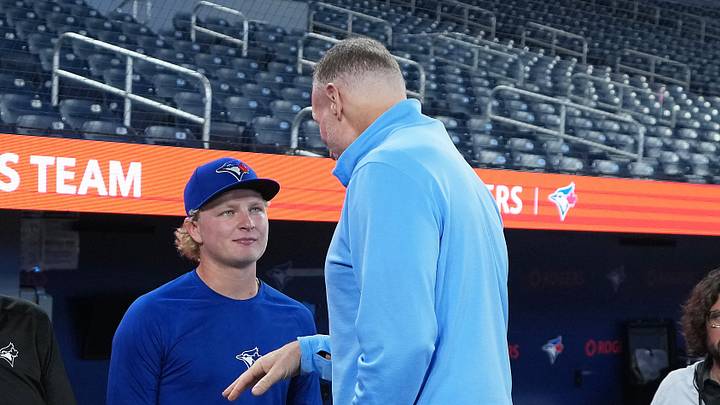 Sep 13, 2025; Toronto, Ontario, CAN; Toronto Blue Jays first round draft pick JoJo Parker talks to president and CEO Mark Shapiro during batting practice before a game against the Baltimore Orioles at Rogers Centre. Mandatory Credit: Nick Turchiaro-Imagn Images