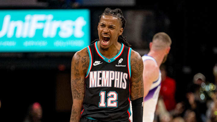 Dec 12, 2025; Memphis, Tennessee, USA; Memphis Grizzlies point guard Ja Morant (12) celebrates after making a three-pointer in the second half against the Utah Jazz at FedExForum. Mandatory Credit: Matthew Smith-Imagn Images