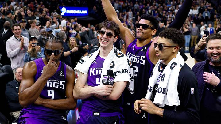 Jan 16, 2026; Sacramento, California, USA; Sacramento Kings forward Precious Achiuwa (9) and center Maxime Raynaud (42) and center Dylan Cardwell (32) and guard Nique Clifford (5) celebrate after lighting the beam in celebration of their victory against the Washington Wizards at Golden 1 Center. Mandatory Credit: Sergio Estrada-Imagn Images