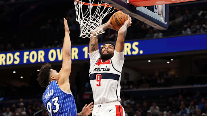 Jan 6, 2026; Washington, District of Columbia, USA; Washington Wizards forward Justin Champagnie (9) dunks over Orlando Magic forward Noah Penda (93) during the second half at Capital One Arena. Mandatory Credit: Daniel Kucin Jr.-Imagn Images