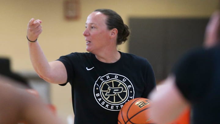 Purdue Boilermakers head coach Katie Gearlds gives drill instructions