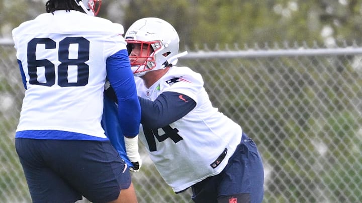 May 9, 2026; Foxborough, MA, USA; New England Patriots tackle Caleb Lomu (74) does a drill with offensive tackle Dametrious Crownover (68) during the New England Patriots rookie camp at Gillette Stadium. Mandatory Credit: Eric Canha-Imagn Images