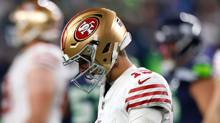 49ers Brock Purdy lowers his head in losing to the Seattle Seahawks