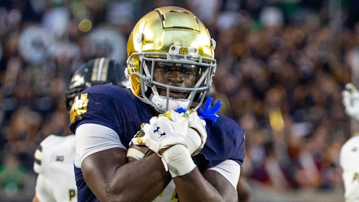 Sep 20, 2025; South Bend, Indiana, USA; A Notre Dame Fighting Irish running back Jeremiyah Love (4) runs the ball against the Purdue Boilermakers during the second half at Notre Dame Stadium. Mandatory Credit: Michael Caterina-Imagn Images