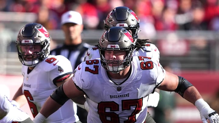 Nov 19, 2023; Santa Clara, California, USA; Tampa Bay Buccaneers offensive tackle Luke Goedeke (67) blocks against San Francisco 49ers linebacker Fred Warner (54) during the second quarter at Levi's Stadium. Mandatory Credit: Darren Yamashita-Imagn Images Nov 19, 2023; Santa Clara, California, USA; Tampa Bay Buccaneers offensive tackle Luke Goedeke (67) blocks against San Francisco 49ers linebacker Fred Warner (54) during the second quarter at Levi's Stadium. Mandatory Credit: Darren Yamashita-Imagn Images