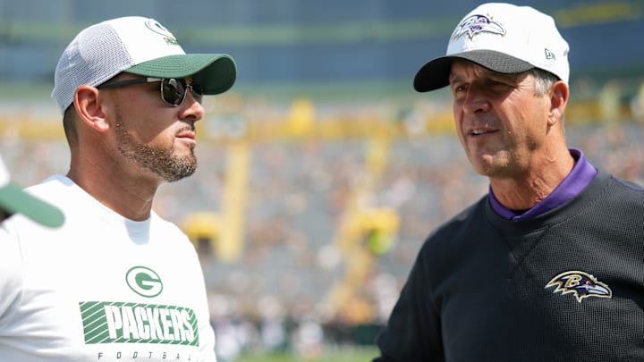 Green Bay Packers head coach Matt LaFleur, former Baltimore Ravens head coach John Harbaugh talking before a game. 