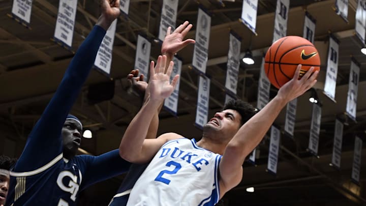 Dec 31, 2025; Durham, North Carolina, USA; Duke Blue Devils guard Cayden Boozer (2) shoots over Georgia Tech Yellow Jackets center Mouhamed Sylia (6) during the second half at Cameron Indoor Stadium.   The Blue Devils won 85-79.  Mandatory Credit: Rob Kinnan-Imagn Images