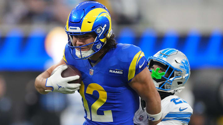 Detroit Lions cornerback Amik Robertson (21) tackles Los Angeles Rams wide receiver Puka Nacua (12) Detroit Lions cornerback Amik Robertson (21) tackles Los Angeles Rams wide receiver Puka Nacua (12)