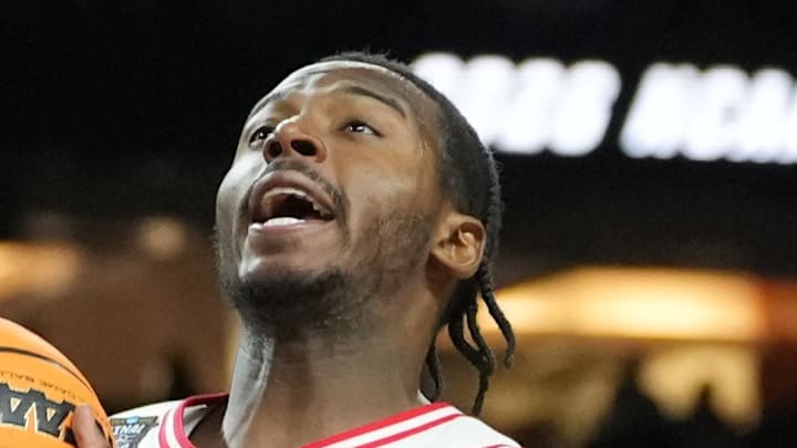 Apr 4, 2026; Indianapolis, IN, USA;  Arizona Wildcats guard Jaden Bradley (0) shoots against Michigan Wolverines forward Morez Johnson Jr. (21) in the second half during a semifinal of the Final Four of the men's 2026 NCAA Tournament at Lucas Oil Stadium. Mandatory Credit: Robert Deutsch-Imagn Images