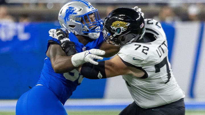 Nov 17, 2024; Detroit, Michigan, USA; Jacksonville Jaguars offensive tackle Walker Little (72) defends against Detroit Lions defensive end Za'Darius Smith (99) during the second half at Ford Field. Mandatory Credit: David Reginek-Imagn Images