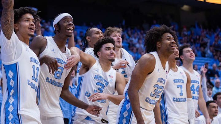 Dec 22, 2025; Chapel Hill, North Carolina, USA; North Carolina Tar Heels forward Jonathan Powell (11), forward Caleb Wilson (8), and guard Derek Dixon (3) react during the second half against the East Carolina Pirates at Dean E. Smith Center. Mandatory Credit: Scott Kinser-Imagn Images