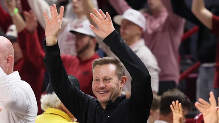 New Arkansas Razorbacks coach Ryan Silverfield “Calls the Hogs” during the second half against the James Madison Dukes at Bud Walton Arena. Arkansas won 103-74.