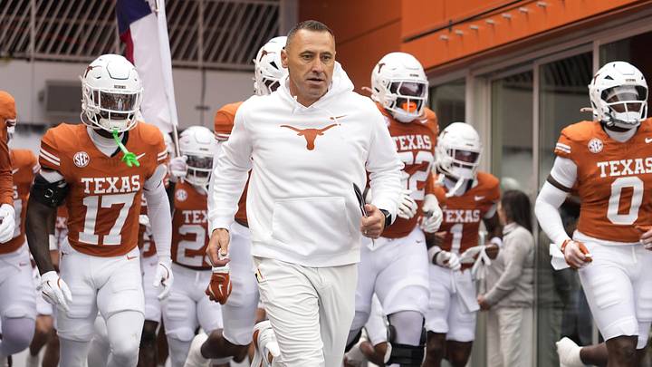 Texas Longhorns head coach Steve Sarkisian leads his team on to the field before a game against the Vanderbilt Commodores.