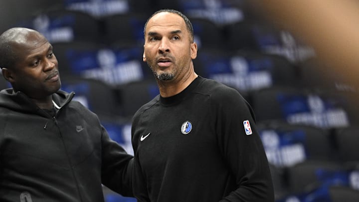 Oct 7, 2024; Dallas, Texas, USA; Dallas Mavericks general manager Nico Harrison (right) looks on during warms up before the game between the Dallas Mavericks and the Memphis Grizzlies at the American Airlines Center. Mandatory Credit: Jerome Miron-Imagn Images