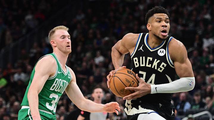Apr 9, 2024; Milwaukee, Wisconsin, USA;  Milwaukee Bucks forward Giannis Antetokounmpo (34) drives for the basket against Boston Celtics forward Sam Hauser (30) in the second quarter at Fiserv Forum. Mandatory Credit: Benny Sieu-Imagn Images