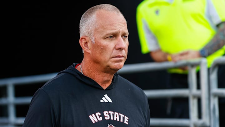 Aug 28, 2025; Raleigh, North Carolina, USA; North Carolina State Wolfpack head coach Dave Doeren walks out during the warmups prior to the game against East Carolina Pirates at Carter-Finley Stadium. Mandatory Credit: Jaylynn Nash-Imagn Images Aug 28, 2025; Raleigh, North Carolina, USA; North Carolina State Wolfpack head coach Dave Doeren walks out during the warmups prior to the game against East Carolina Pirates at Carter-Finley Stadium. Mandatory Credit: Jaylynn Nash-Imagn Images