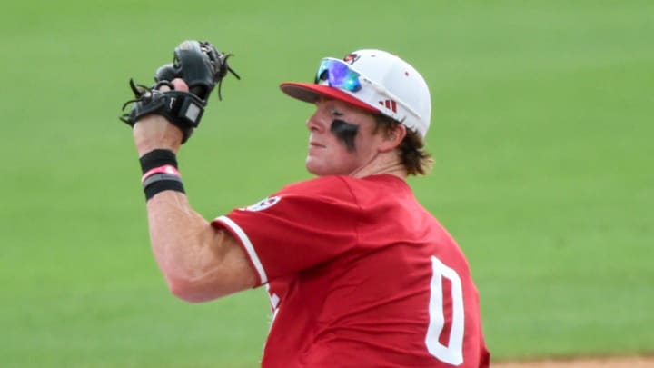 Stetson Hatters' Isaiah Barkett (13) slides safely under the tag of NC State Wolfpack's Luke Nixon (0) during the NCAA Baseball Regional Tournament at Plainsman Park in Auburn, Ala., on Friday May 30, 2025.