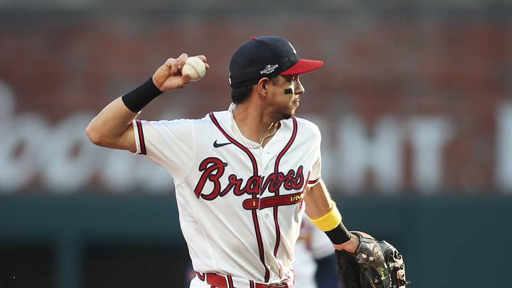 Oct 7, 2026; Cumberland, Georgia, USA;  Atlanta Braves outfielder Mauricio Dubon (14) throws to first for an out against the Los Angeles Dodgers during the first inning in game four of the NLDS for the 2026 MLB Playoffs at Truist Park.  Mandatory Credit: Brett Davis-Imagn Images