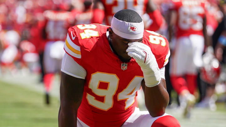 Aug 17, 2024; Kansas City, Missouri, USA; Kansas City Chiefs defensive end Malik Herring (94) kneels on field against the Detroit Lions prior to the game at GEHA Field at Arrowhead Stadium. Mandatory Credit: Denny Medley-Imagn Images