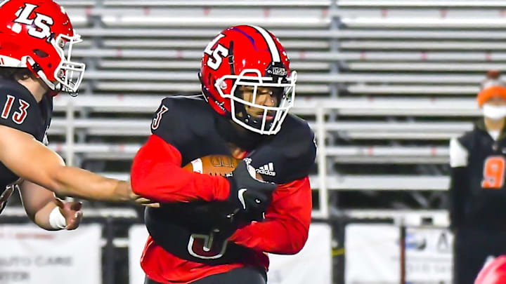 Gi'Bran Payne (3) of La Salle takes a handoff from Zach Branam (13) against Anderson during a OHSAA playoff game Friday, Oct. 30, 2020 at La Salle High School

Anderson La Salle20201030 0014