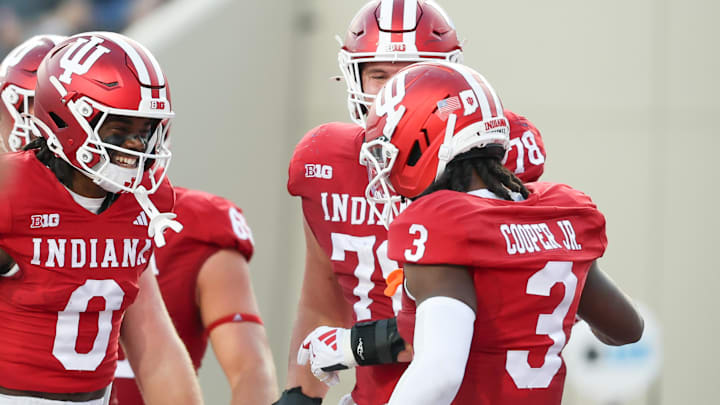 Indiana receivers Jonathan Brady (0) and Omar Cooper Jr. (3) celebrate after a touchdown against Indiana State. Indiana receivers Jonathan Brady (0) and Omar Cooper Jr. (3) celebrate after a touchdown against Indiana State.