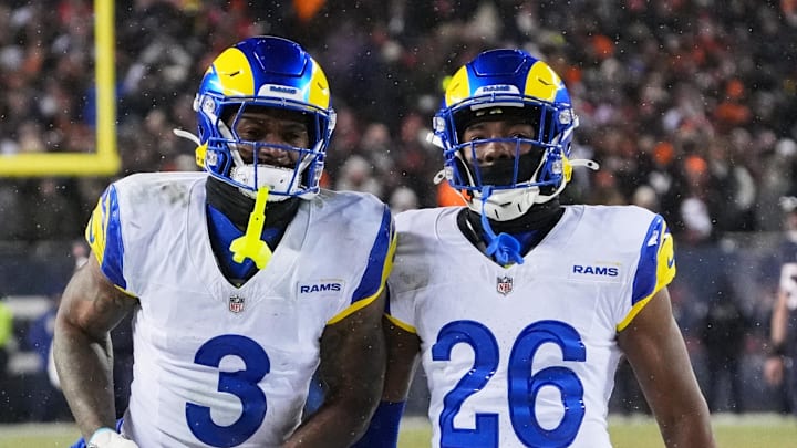 Jan 18, 2026; Chicago, IL, USA; Los Angeles Rams safety Kam Curl (3) celebrates with safety Kamren Kinchens (26) after intercepting a pass intended for Chicago Bears wide receiver DJ Moore (not pictured) during overtime of an NFC Divisional Round game at Soldier Field. Mandatory Credit: David Banks-Imagn Images