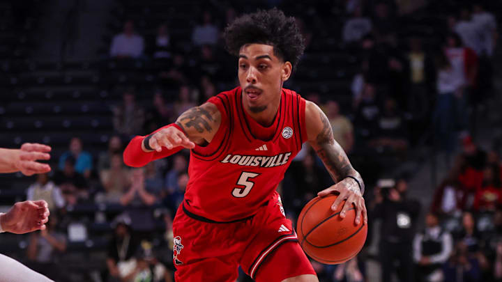 Feb 1, 2025; Atlanta, Georgia, USA; Louisville Cardinals guard Terrence Edwards Jr. (5) drives to the basket against the Georgia Tech Yellow Jackets in the first half at McCamish Pavilion.