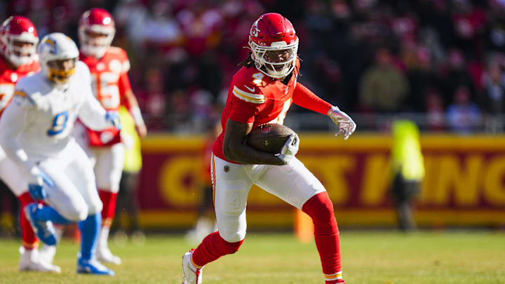 Dec 14, 2025; Kansas City, Missouri, USA; Kansas City Chiefs wide receiver Rashee Rice (4) runs for yards after the catch against the Los Angeles Chargers during the first quarter at GEHA Field at Arrowhead Stadium. Mandatory Credit: Jay Biggerstaff-Imagn Images