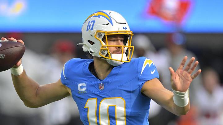 Dec 15, 2024; Inglewood, California, USA;  Los Angeles Chargers quarterback Justin Herbert (10) sets to pass in the first half against the Tampa Bay Buccaneers at SoFi Stadium. Mandatory Credit: Jayne Kamin-Oncea-Imagn Images