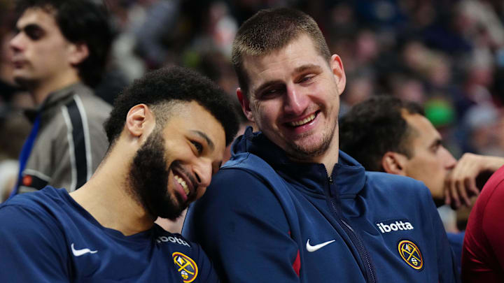 Dec 28, 2023; Denver, Colorado, USA; Denver Nuggets center Nikola Jokic (15) and guard Jamal Murray (27) react on the bench during the fourth quarter against the Memphis Grizzlies at Ball Arena. Mandatory Credit: Ron Chenoy-Imagn Images Dec 28, 2023; Denver, Colorado, USA; Denver Nuggets center Nikola Jokic (15) and guard Jamal Murray (27) react on the bench during the fourth quarter against the Memphis Grizzlies at Ball Arena. Mandatory Credit: Ron Chenoy-Imagn Images