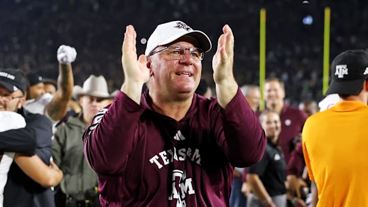 Sep 13, 2025; South Bend, Indiana, USA; Texas A&M Aggies head coach Mike Elko celebrates after the game against Notre Dame Fighting Irish at Notre Dame Stadium. Mandatory Credit: Trevor Ruszkowski-Imagn Images