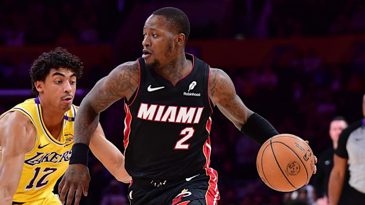 January 15, 2025; Los Angeles, California, USA; Miami Heat guard Terry Rozier (2) moves the ball against Los Angeles Lakers guard Max Christie (12) during the first half at Crypto.com Arena. Mandatory Credit: Gary A. Vasquez-Imagn Images