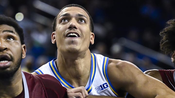 Nov 4, 2024; Los Angeles, California, USA; UCLA Bruins guard Kobe Johnson (center) jockeys for position under the basket between Rider Broncs forward Tariq Ingraham (left) and Rider Broncs guard T.J. Weeks Jr. (right) during the first half at Pauley Pavilion presented by Wescom. Mandatory Credit: Robert Hanashiro-Imagn Images