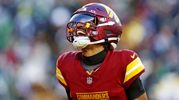 Dec 22, 2024; Landover, Maryland, USA; Washington Commanders quarterback Jayden Daniels (5) celebrates after throwing a touchdown during the fourth quarter against the Philadelphia Eagles at Northwest Stadium. Mandatory Credit: Peter Casey-Imagn Images Dec 22, 2024; Landover, Maryland, USA; Washington Commanders quarterback Jayden Daniels (5) celebrates after throwing a touchdown during the fourth quarter against the Philadelphia Eagles at Northwest Stadium. Mandatory Credit: Peter Casey-Imagn Images
