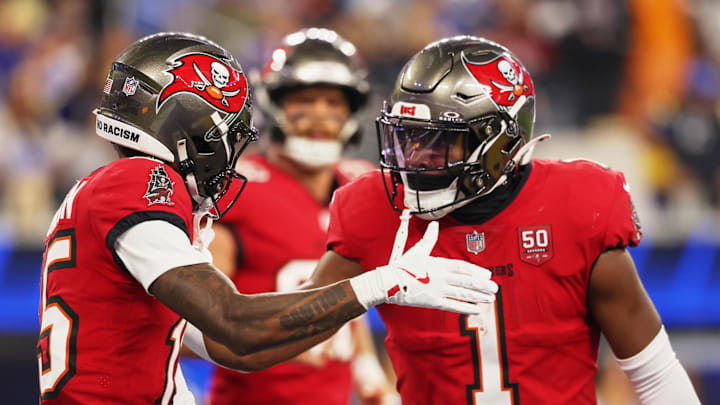 Nov 23, 2025; Inglewood, California, USA; Tampa Bay Buccaneers wide receiver Tez Johnson (15) celebrates with running back Rachaad White (1) after scoring a touchdown against the Los Angeles Rams during the second quarter at SoFi Stadium.