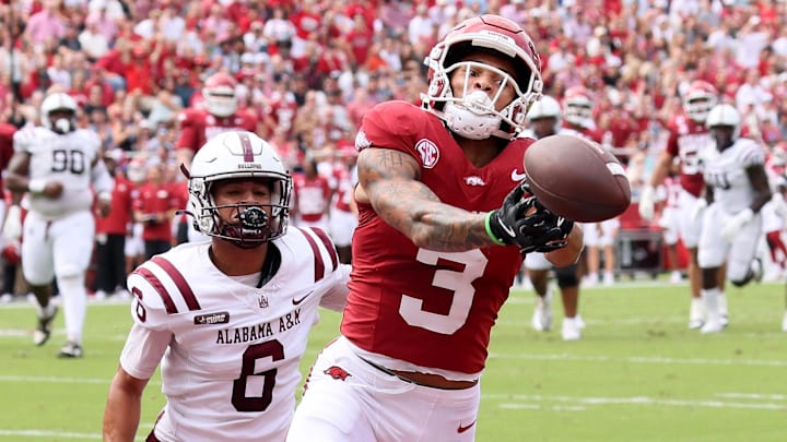 Arkansas Razorbacks wide receiver CJ Brown (3) attempts to make a catch in the first quarter as Alabama A&M Bulldogs defensive back Lynn Pettway (6) defends at Razorback Stadium.